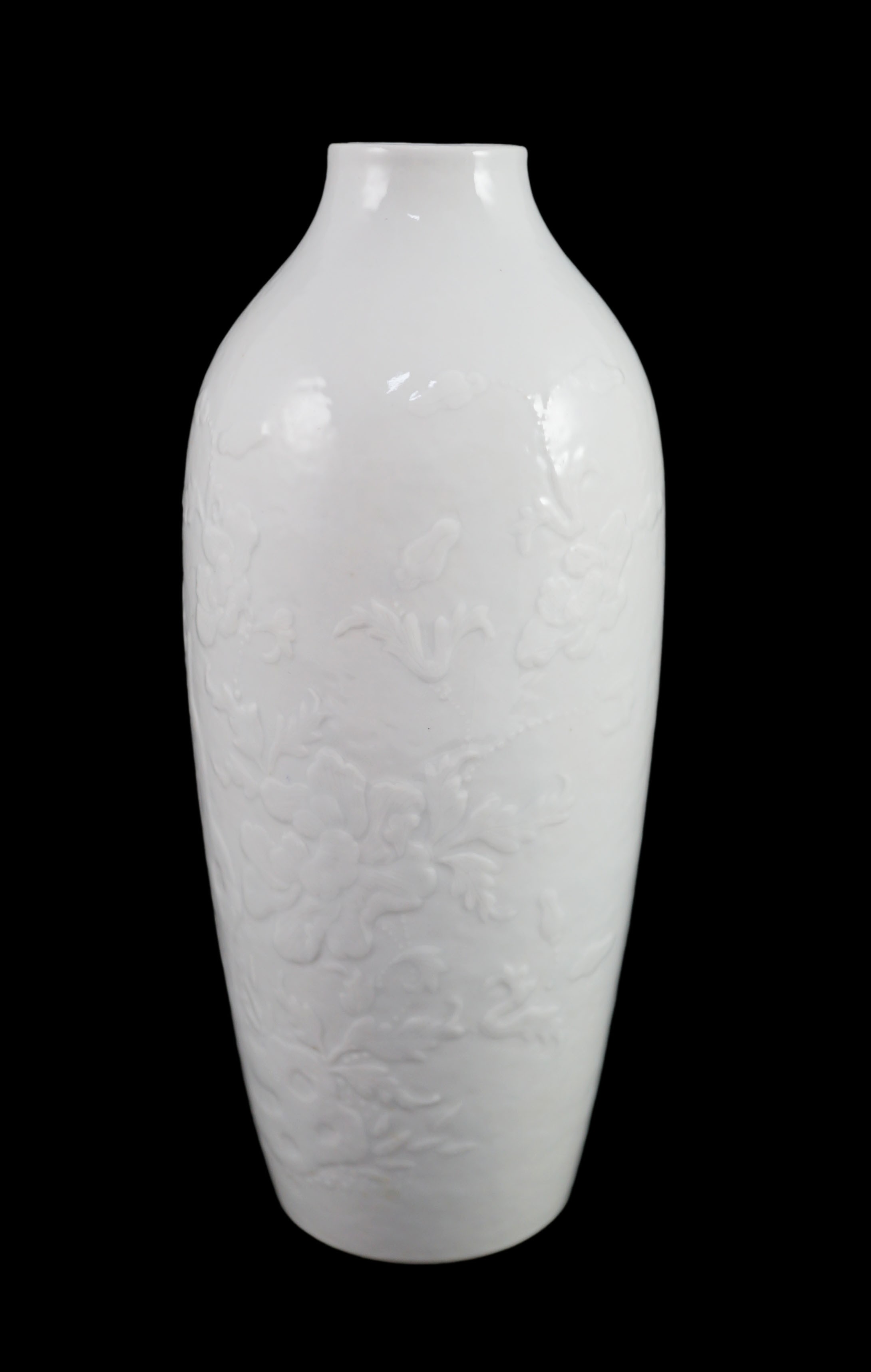 A Chinese moulded white glazed vase, Qianlong period, 18.3cm high, glaze blemish